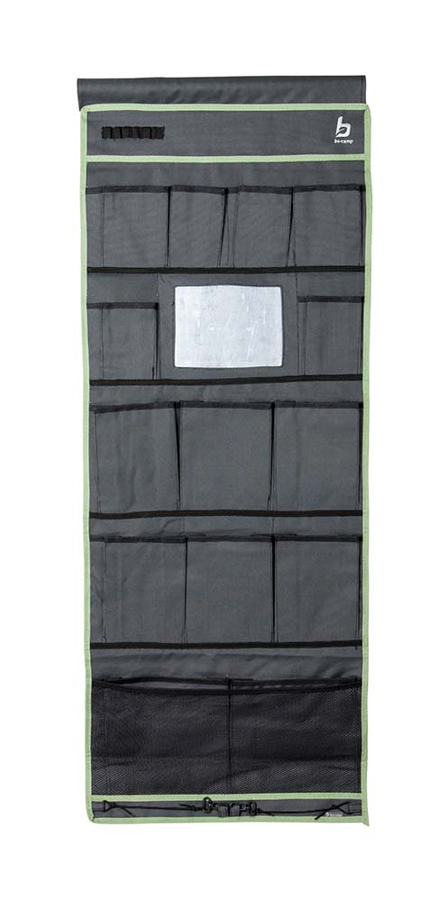 1771510 A multi-functional 15 compartment organizer with mirror. Made from a high quality Two-Tone 600D Oxford Polyester. Has 2 large compartments 6 medium compartments six small compartments and a mirror. Simple, and can be mounted in various ways. This pelmet can be hung on a caravan rail with the string, with velcro to the tent pole or with eyelets on hooks. The loops at the bottom provide additional fixation.
